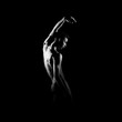 © Acronym - Black and white silhouette of male ballet dancer.