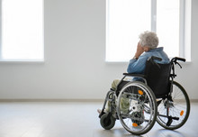 Lonely Senior Woman In Wheelchair Indoors
