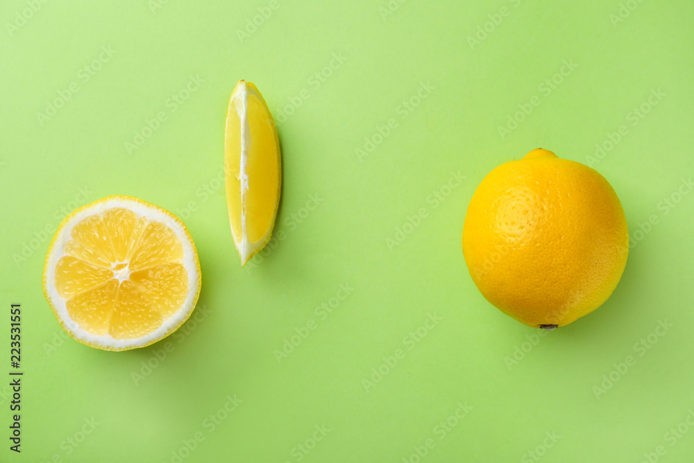 Ripe lemons on color background