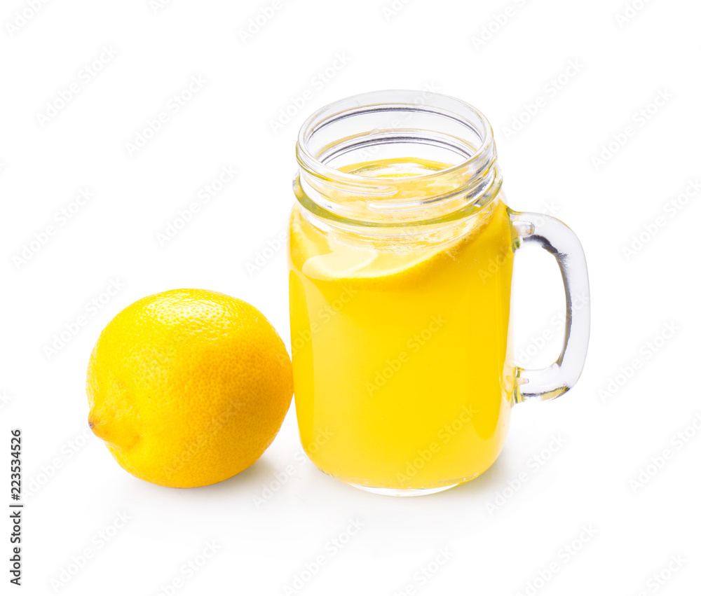 Mason jar of fresh lemon juice on white background