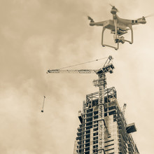 Vintage Tone Image Of Drone Over Construction Site Of Modern Office And Residential Building In Singapore. Concept Of Video Surveillance Or Industrial Safety Inspection
