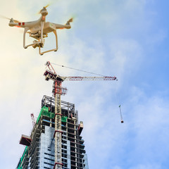 drone over construction site of modern office and residential building in singapore. concept of vide