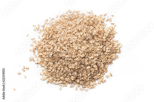 Fotografía Pile of oat flakes on white background, blue
