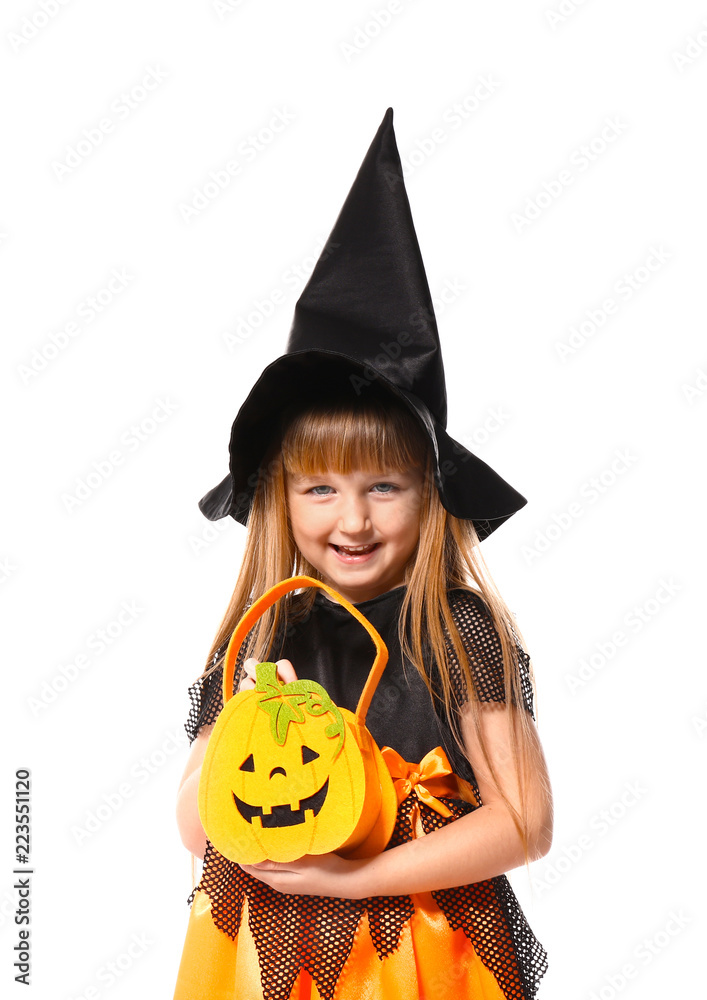 Cute little girl dressed as witch for Halloween on white background