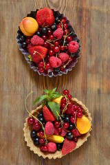 Wall Mural - Mini Tart with fresh berries and mint, vertical, top view