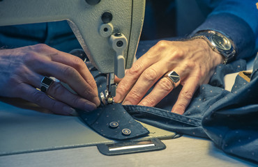 Sewing machine and hands of the master