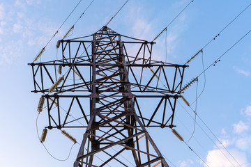 high voltage tower against the blue sky.