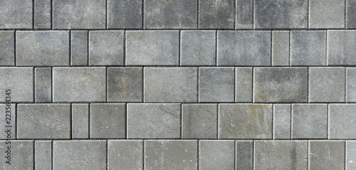 Cuadros en Lienzo Concrete or cobble gray pavement slabs or stones for floor, wall or path