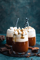 Wall Mural - Hot chocolate with whipped cream. Chocolate dessert drink in glass