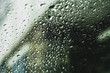 © Cavan Images - Close-up of wet windshield during rainy season