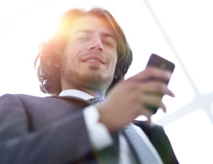 Wall Mural - bottom view.business men reading SMS on smartphone