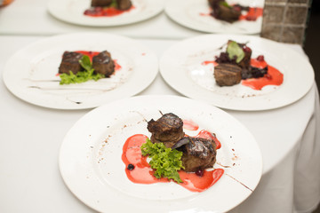 fried beef steaks with spices, on a white table