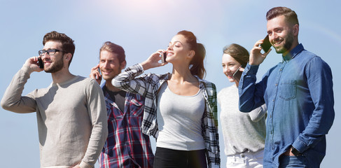 Canvas Print - closeup of a group of young people with smartphones.