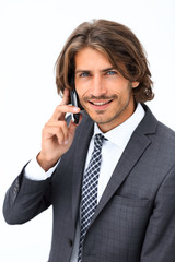 Canvas Print - young man listening on a phone on a white background