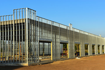 Wall Mural - Steel framing members of new commercial building under construction.