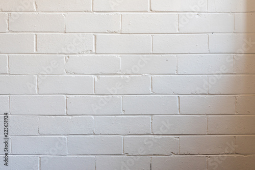 White Painted Interior Brick Wall With Natural Shadow From