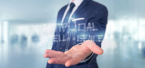 Poster - Businessman holding an artificial inteligence robot made of light 3d rendering
