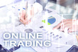 © Funtap - Online trading, FOREX, Investment concept on blurred business center background.