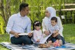 © faizzaki - Malay family at recreational park having fun