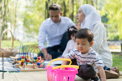 Cuadros en Lienzo Malay family at recreational park having fun