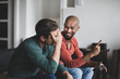 © ReeldealHD images - Male friends playing on a games console