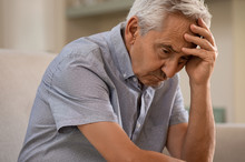 Depressed Senior Man At Home