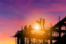Silhouette Of Engineer And Worker On Building Site, Construction Site With Clipping Path At Sunset In Evening Time.