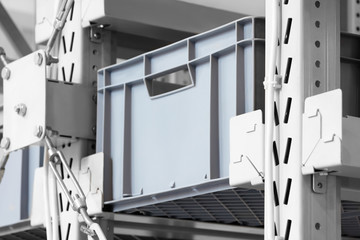 Fototapete - Plastic containers on the modern warehouse for piece small storage of goods