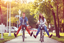 Happy Autumn  Funny Couple Riding On Bicycle