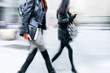 © bluraz - motion blurred business people walking on the street