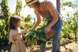 © Jacob Lund - Mother and daughter with fresh vegetable in farm