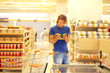 © lado2016 - Man choosing frozen food from a supermarket freezer