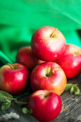 group of red apples on wooden natural background, fresh natural food and vitamins concept in rustic style