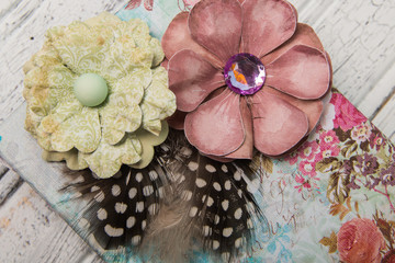 Wall Mural - Paper flowers and feathers with vintage prints