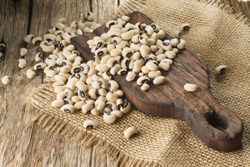 Wall Mural - white bean grains on rustic background - Phaseolus