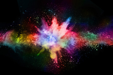 abstract colored dust explosion on a black background.abstract powder splatted background,freeze mot