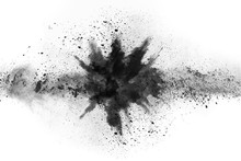 Particles Of Charcoal On White Background,abstract Powder Splatted On White Background,Freeze Motion Of Black Powder Exploding Or Throwing Black Powder.