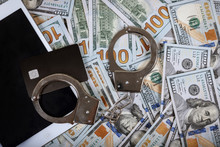 Credit Cards And Dollar Bills Handcuffed Financial Crimes.