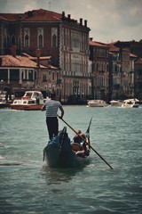 Gondola in canal in Venice