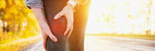 Arthritis Athlete. Injuries - Sports Running Knee Injury Woman.  Closeup Of Leg, And Knee Outdoors.