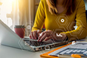 woman hand working with laptop computer, tablet and smart phone in modern office with virtual icon diagram at modern office.