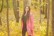 © satura_ - Autumn, nature and people concept - Portrait of plus size woman in pink jacket in park