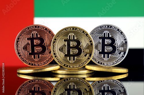 Fotografie, Obraz Physical version of Bitcoin (BTC) and United Arab Emirates Flag