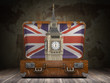 Trip to London. Travel or tourism to England or Great Britain concept. Big Ben tower in the open vintage suitcase.