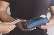Credit card swipe through terminal for sale in store. Shopping and retail concept