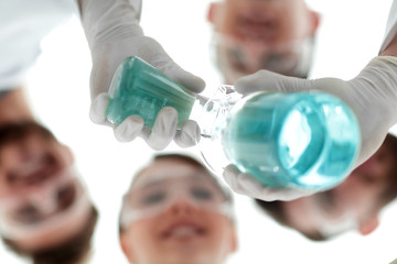 Wall Mural - image is blurred. beakers in hand, and scientists