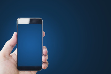 hand holding mobile smart phone, blank blue screen, on gradient blue background