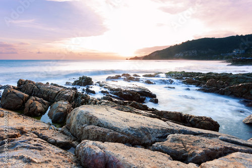 Fényképezés Long exposure image of Dramatic sky seascape with rock in sunset scenery background