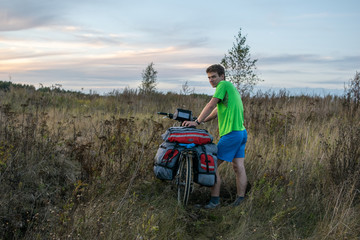 Bicyclist in the field in Russia