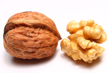 Sticker - Whole and peanut walnut on a white background